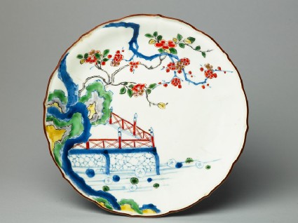 Petalled plate depicting prunus and camellia growing by a terracetop
