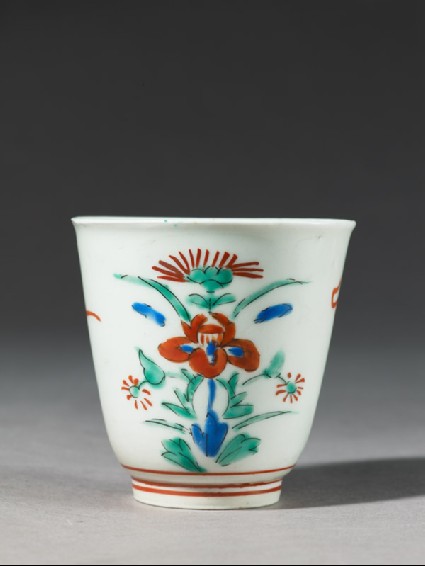 Cup with formal floral designside