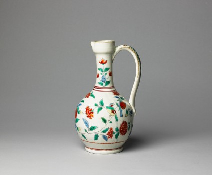 Jug with formal flower sprays and birdsside