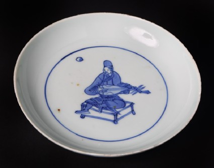 Blue-and-white dish with seated musician playing a lutefront
