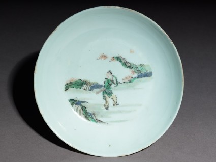 Dish with a fisherman carrying oar and a baskettop