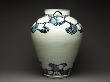 Jar with peony foliage and blossomsside