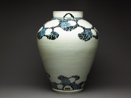 Jar with peony foliage and blossomsside