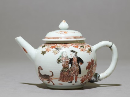 Teapot depicting a couple with a dogside