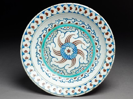 Dish with whirling rosette and prunus blossomtop