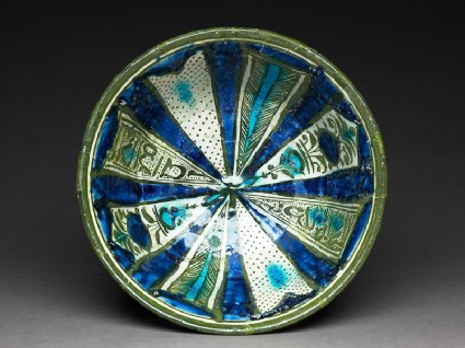 Bowl with radiating panelstop