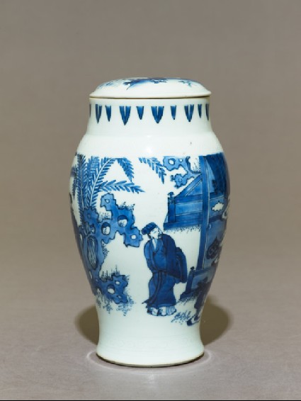 Blue-and-white jar and lid with couple in a gardenside