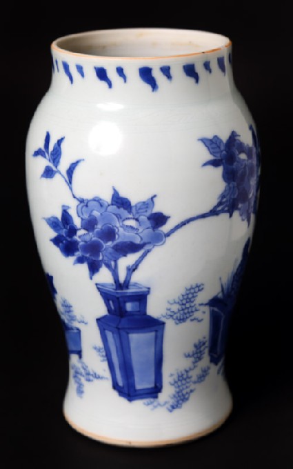 Blue-and-white vase with plants in containersfront