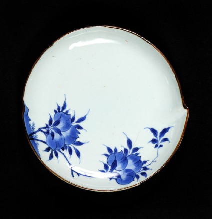 Blue-and-white dish with flowering peach branchesfront