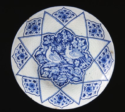 Dish with pheasants amid foliagetop