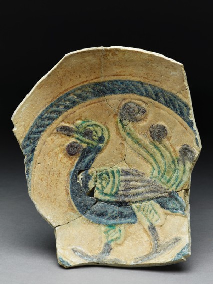 Fragment of a dish with peacocktop