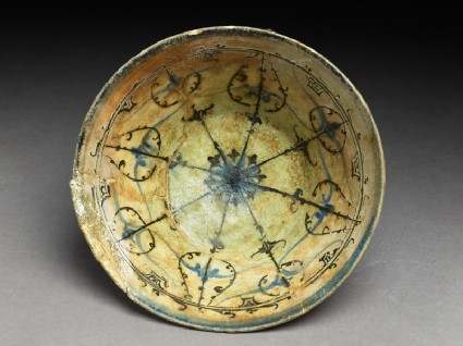 Bowl with rosette and radiating bandstop