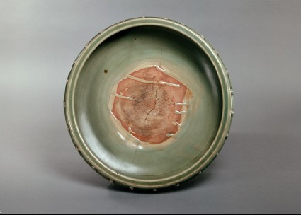 Greenware bowl with rosettes and animal mask feettop