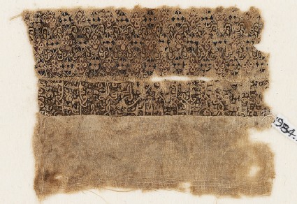 Textile fragment with quatrefoils and interlacing kufic scriptfront