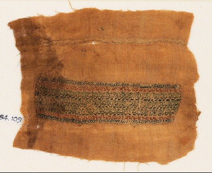 Textile fragment with bands of scrolls, inscription, and chevronsfront