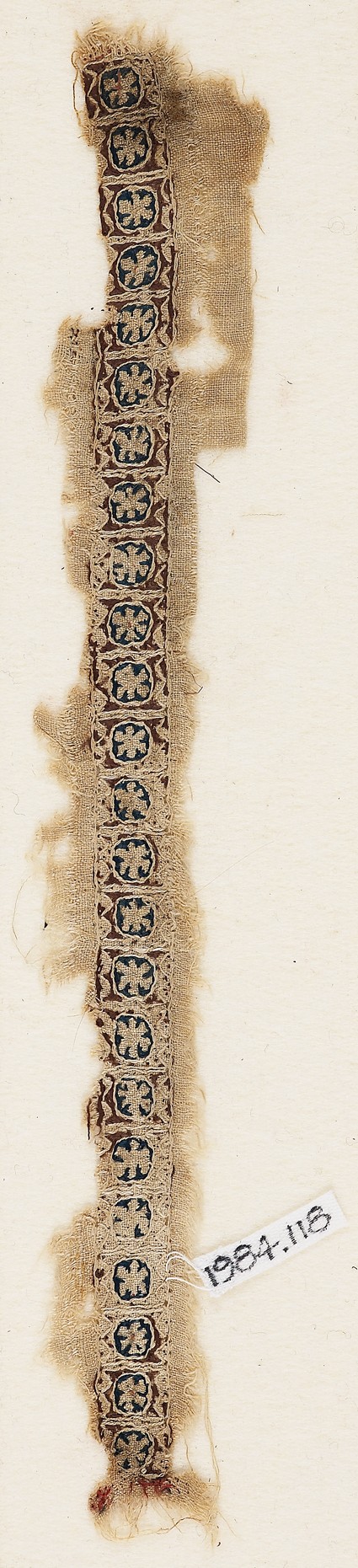 Textile fragment with circles and rosettesfront