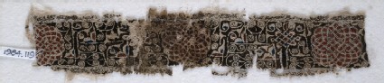 Textile fragment with interlacing scrolls and knotted patternfront