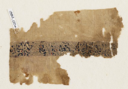 Textile fragment with naskhi inscription and scrolls, probably from a garmentfront