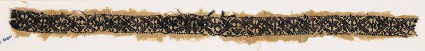 Textile fragment with diamond-shapes and crossesfront