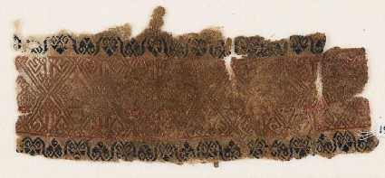 Textile fragment with linked diamond-shapes and possibly birdsfront