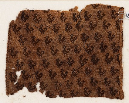 Textile fragment with birds with curving tails, probably from a tunicfront