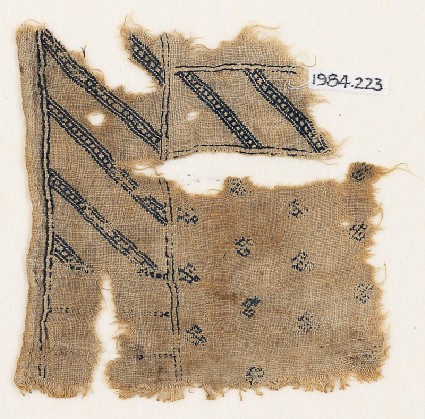 Textile fragment with diagonal stripes and crested birdsfront