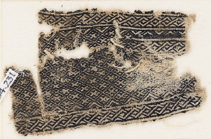 Textile fragment with grid of diamond-shapesfront
