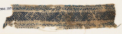 Textile fragment with diamond-shapes, spirals, and stylized tendrilsfront