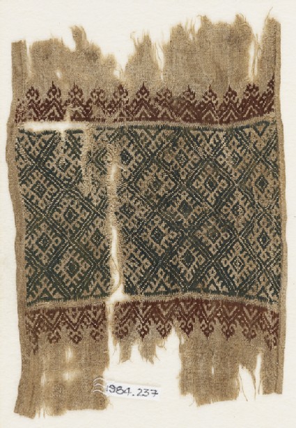 Textile fragment with linked diamond-shapes, triangles, and palmettesfront