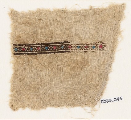 Textile fragment with band of diamond-shapesfront