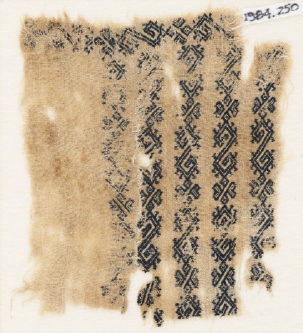Textile fragment with bands of S-shapes, hooks, and leavesfront