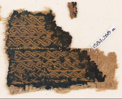 Textile fragment with bands of interlaced braidfront