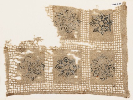 Textile fragment with interlace rosettes, stars, and flowersfront
