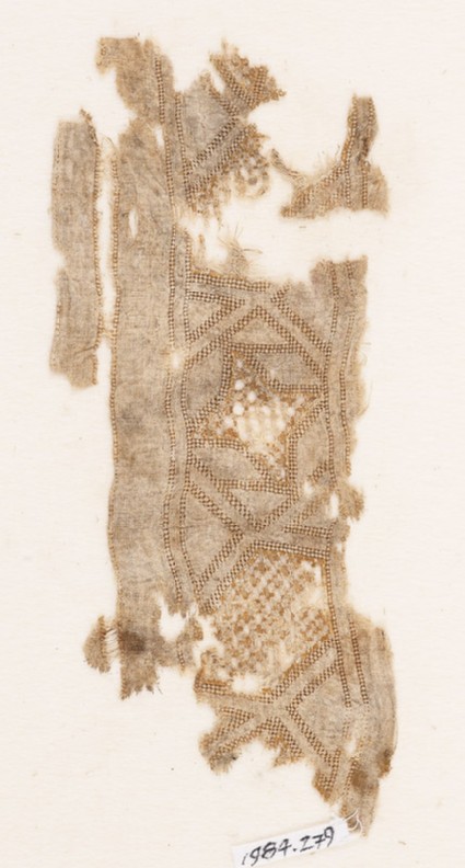 Textile fragment with stars and rhombic shapesfront