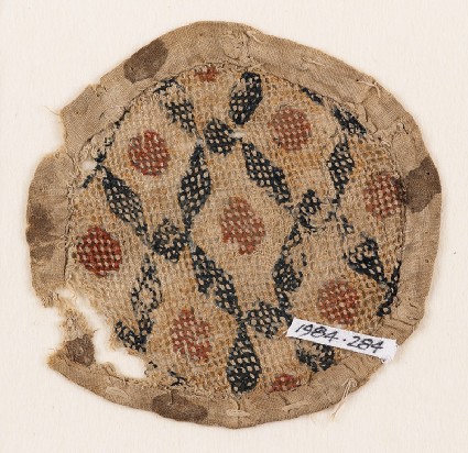 Textile fragment with rhombic shapes and squares, probably from a purse or seal-bagfront