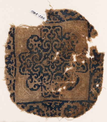 Textile fragment with rosette and scrollsfront