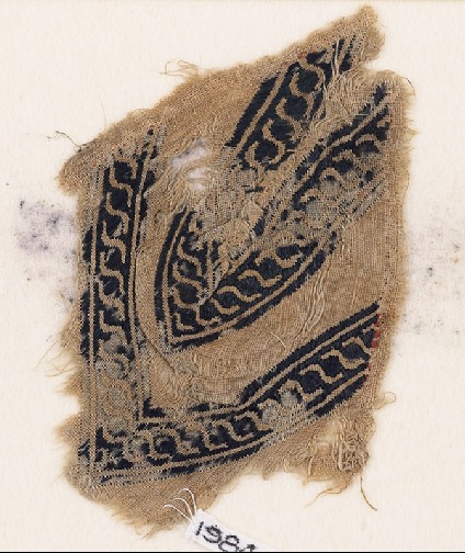 Textile fragment with linked scrolls of S-shapes, possibly from a garmentfront