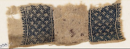 Textile fragment with grid and stylized letterfront