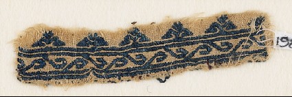 Textile fragment with scroll and floral trefoilsfront