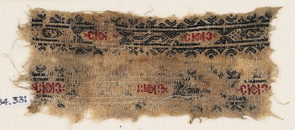 Textile fragment with bands of hexagonal cartouches, S-shapes, diamond-shapes, and crescentsfront