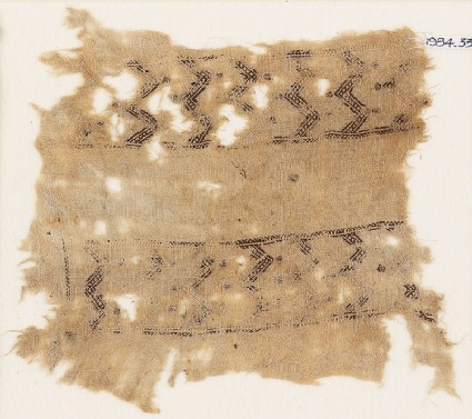 Textile fragment with bands of double chevrons and flowersfront