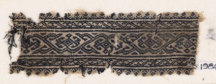 Textile fragment with vine and diamond-shaped flowersfront