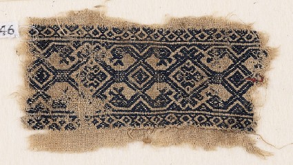 Textile fragment with interlace, and heads of serpents or birdsfront