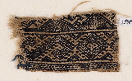 Textile fragment with bands of diamond-shapes and S-shapesfront