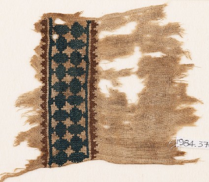 Textile fragment with band of linked ovals and zigzag borderfront