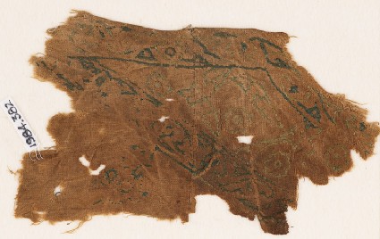 Textile fragment with vines and leaves, probably from a garment or trousersfront