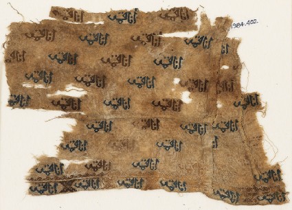 Textile fragment with repeated inscriptionfront