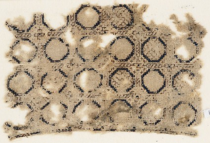 Textile fragment with circles set into a gridfront
