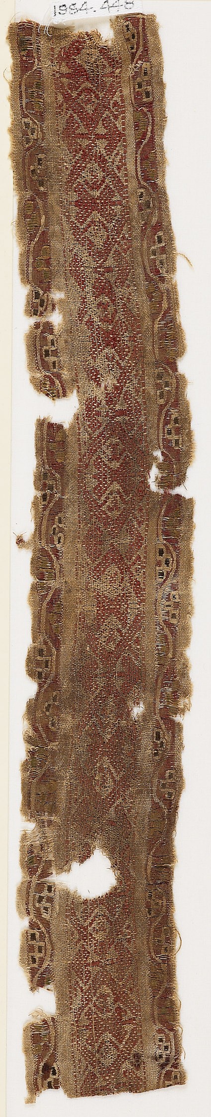 Textile fragment with band of linked diamond-shapesfront