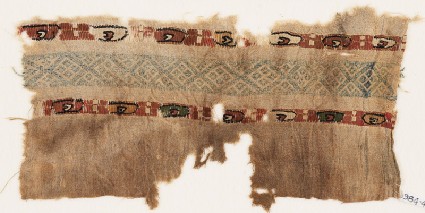 Textile fragment with two bands of ovals containing small crescentsfront